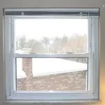 **Defenestration?**

I’ve spent a great many hours over the last week working on my biggest projects yet: window trim. I’ve learned a lot (and purchased a great many tools).  
  

Here’s where we started. As you can see, they have no trim and there is a marble sill. All in all, I’m reminded of the cheap apartment I lived in during college. We’re planning on painting soon, so we decided to add trim first. I started in the master bath because we’re not using it much, so if the project went horribly we could just seal it off and pretend it never happened.  
  
My father helped me come up with a plan. Our house doesn’t have much in the way of trim now, so we were starting with a blank slate: we’ll use the same pattern throughout the house eventually. We decided on a design that will provide some shadow lines but will be simple-looking enough to go with the house’s modern exterior. We chose to use poplar because we intend to paint– we didn’t want a wood with a lot of grain.

  
Here’s the finished product. The side casings are 1x4 and the head casing and apron are 1x6. The back band is 2x2 rabbeted into an L-shape and then trimmed down to ¾ in on the front face and coped to the wall. Originally, we had no back band, a 1x8 head casing, and I planned to install strips of molding at the top of the cap and under the apron. The intent was to make the ceiling look taller, but it was just too much, especially for a tiny bathroom.  
  
I’m delighted with how the window turned out. I still need to fill in the nail holes, sand, and prepare the window for painting. We have two windows to do in our bedroom. I’ll start those just as soon as I figure out how to cram 8 ft boards into the Golf.