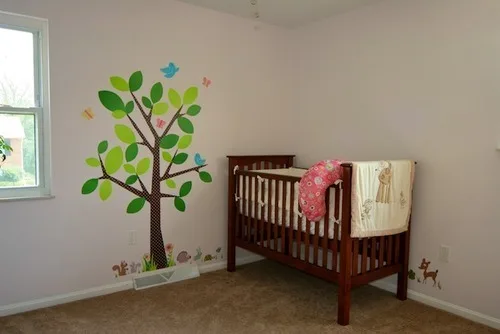 **A tree grows in...**

Miss Abigail’s room!

We added some cute decals to liven up the nursery.  I wasn’t sure that I liked them as much in-person as I did on-line, but I think they look pretty nice now.  They’re playful.  People kept asking me about a “nursery theme.”  Now I guess we actually have one.  Well, perhaps we have many: woodlands, animals, nature.  Next step is to find a nice mobile.  (John should have an upcoming post about resizing closet doors and window trim.  Lots of changes!)