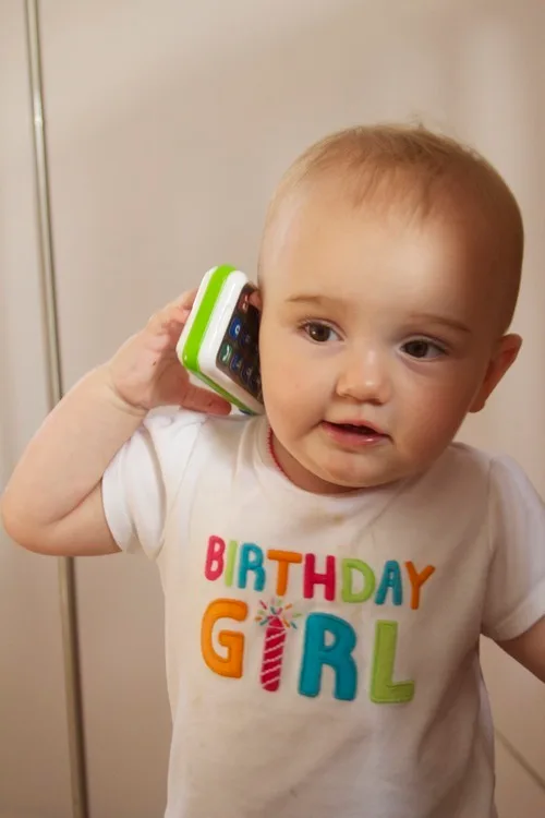 **The birthday girl**

Likes steak… a lot.  

But is still willing to share.  

Is apprehensive about singing birthday candles.

And likes her new telephone toy.