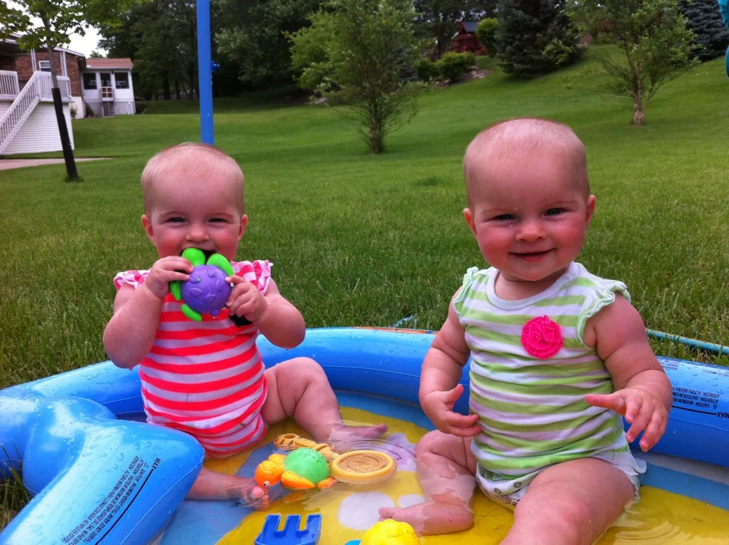 Much like Abby, the babies like water. They had a great first time splashing around in the pool. (Abby did too. Afterwards she requested hot chocolate to warm up. I suggested sunshine.)