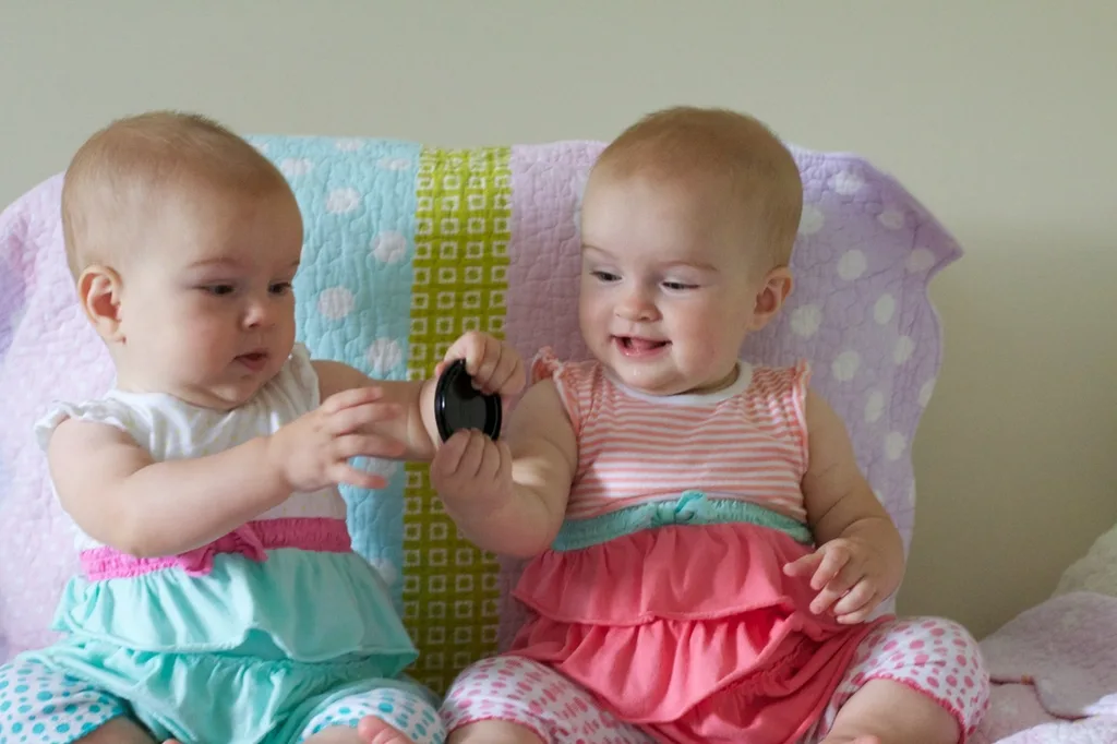 Eight and a half months old! Lots of baby talk (“ma!”) and crawling (attempts by Gwen and rapid acceleration by Josie). Favorite foods right now are cheese and bananas.