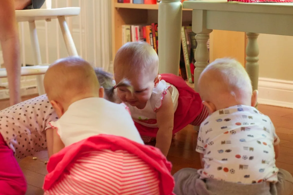 Babies! Babies! Babies! The scene at our house today. Four babies (two sets of nine month old twins) crawling around the kitchen floor hunting for Cheerios. It was a pretty amazing sight.