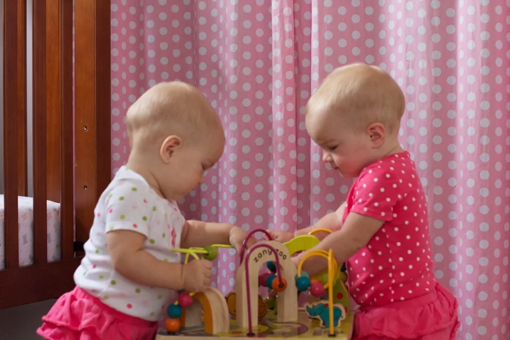 Gosh, are they getting big! Since we had a relaxing day at home today, I was encouraged to break out the camera. They don’t really hold still for long, but I was able to snap a few shots while they played — together!

One thing that really strikes me about twins is that they’re already playing together. It seemed like Abby was much older before she started playing with other babies. I guess when you’re always around another baby and you have a big sister, you figure out there’s fun to be had. They frequently play together, get into trouble together, and they seem to be having conversations already too. That last part is quite impressive since their only consistently recognizable word is “Ma.”