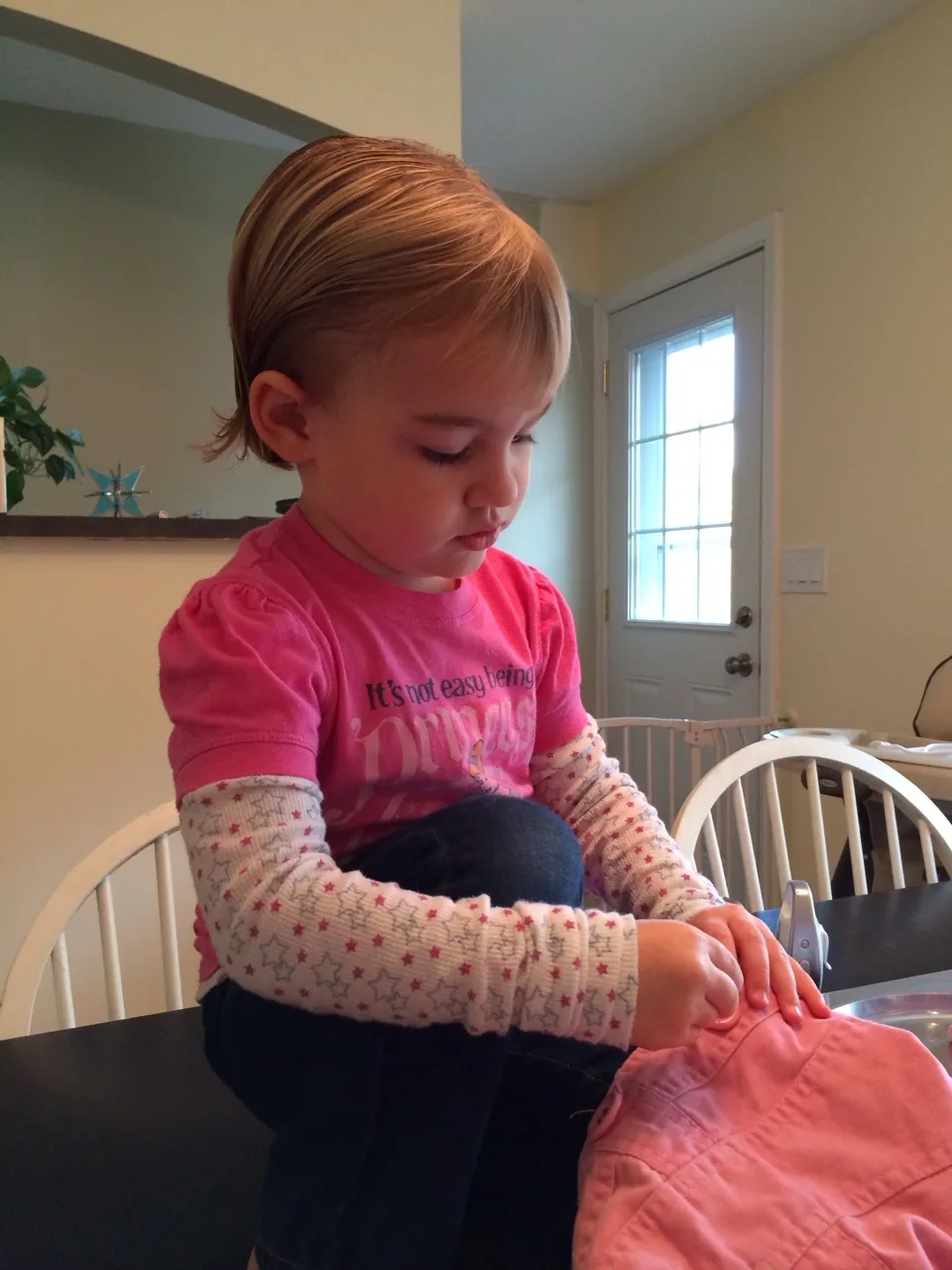 The careful seamstress concentrating during her sewing lesson.