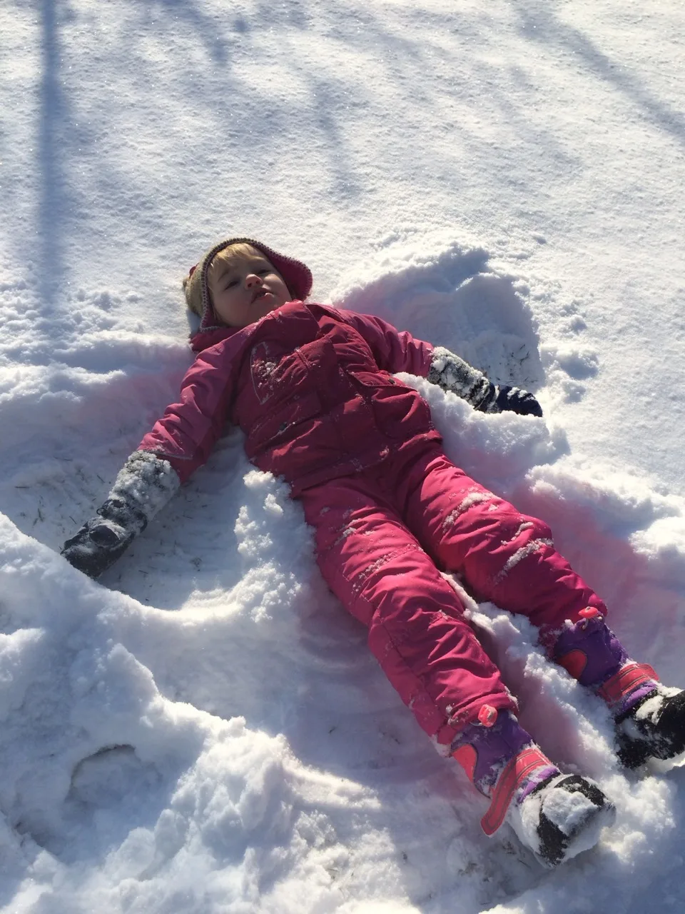 With more snow coming soon, I was reminded that I didn’t post any photos from our last big snowstorm. John and I had a great time taking Abby outside. Abby loves to ride her sled, make snow angels, stomp around, toss snowballs, and eat snow. Yes, she really likes to EAT snow.