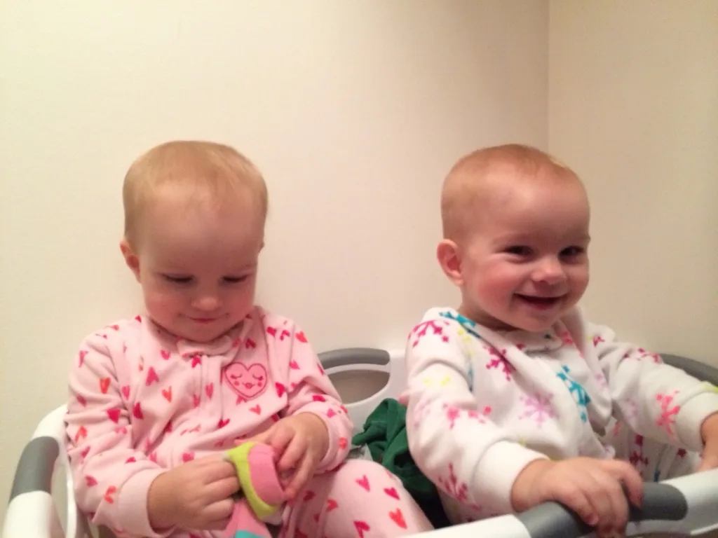 Instead of going to bed tonight, both babies tried to escape from me by climbing into the laundry basket!