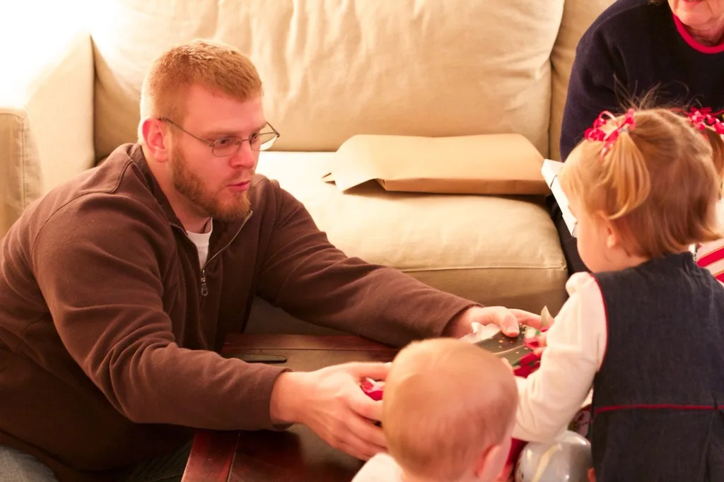 We enjoyed our annual Christmas Eve celebration with family at our house. The girls had fun helping everyone open their presents during the gift grab. Looking back at the pictures to select some for this post, it looks like Ron was the most excited about his present. Good thing no one stole it!