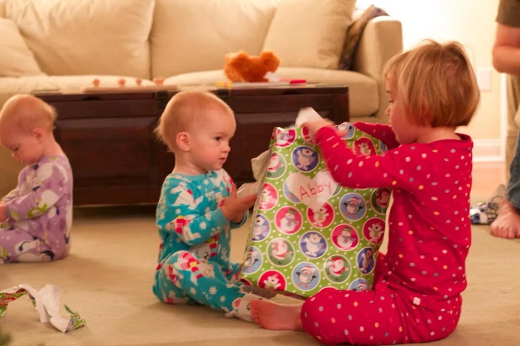 This was our best Christmas morning so far. Abby woke up first, and was surprisingly willing to let the presents sit untouched while we waited for her sisters to wake up. Josie was the second to wake, but no such luck with her. She wanted to investigate! We ended up encouraging Gwen to get out of bed so we could see what Santa brought us.

The girls had lots of fun opening their gifts, and giving gifts. The highlights were a toy train set, an indoor trampoline, some very cute animal hats and gloves, and a bright red toy monster truck for Papa, who just wanted a nice German car. (That was Abby’s gift to John. She looked at Papa’s preferred cars at the store and said they were “too grey, too blue, too boring.” She instead bought a fire truck for Josie, a camper with a beach scene for Gwen, and the monster truck for John. No sports cars for her!)

We took lots of pictures, but Tumblr only allows ten per post. (Sigh.) Christmas afternoon coming next.