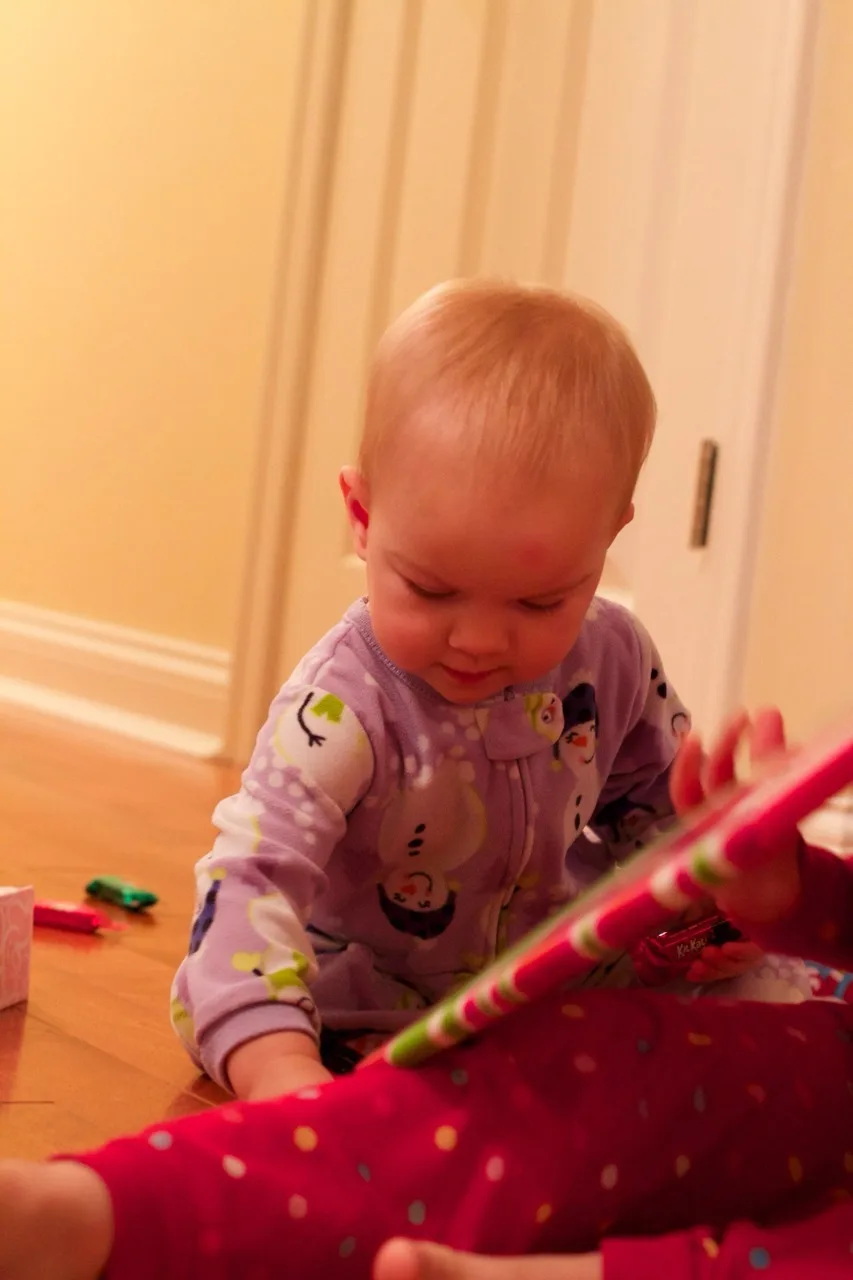 This was our best Christmas morning so far. Abby woke up first, and was surprisingly willing to let the presents sit untouched while we waited for her sisters to wake up. Josie was the second to wake, but no such luck with her. She wanted to investigate! We ended up encouraging Gwen to get out of bed so we could see what Santa brought us.

The girls had lots of fun opening their gifts, and giving gifts. The highlights were a toy train set, an indoor trampoline, some very cute animal hats and gloves, and a bright red toy monster truck for Papa, who just wanted a nice German car. (That was Abby’s gift to John. She looked at Papa’s preferred cars at the store and said they were “too grey, too blue, too boring.” She instead bought a fire truck for Josie, a camper with a beach scene for Gwen, and the monster truck for John. No sports cars for her!)

We took lots of pictures, but Tumblr only allows ten per post. (Sigh.) Christmas afternoon coming next.