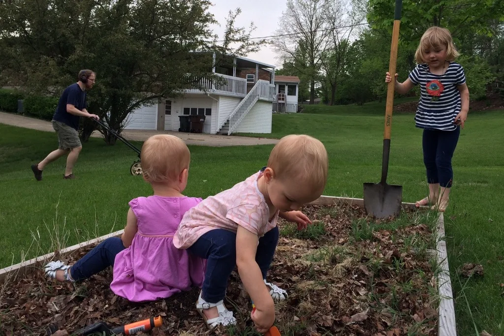 Ah, what a good day today turned out to be! I mostly wrote the day off this morning since I knew Gwen and Josie would get their eighteen month shots today, but, apparently, they’re troopers! After their afternoon naps, we took a nice long walk to get ice cream. Then after dinner, my helpers assisted me with turning over the garden bed while Papa mowed the grass. They even had a good time on the swings.