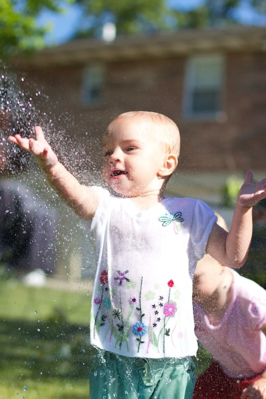 The girls, especially Gwen, had so much fun playing in the hose today. Gwen loved being sprayed in the face – just like her big sister at this age. I think we might have at least two future swimmers amongst us!