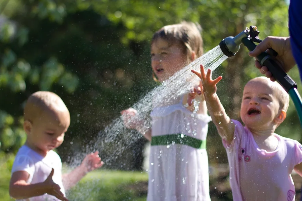 The girls, especially Gwen, had so much fun playing in the hose today. Gwen loved being sprayed in the face – just like her big sister at this age. I think we might have at least two future swimmers amongst us!