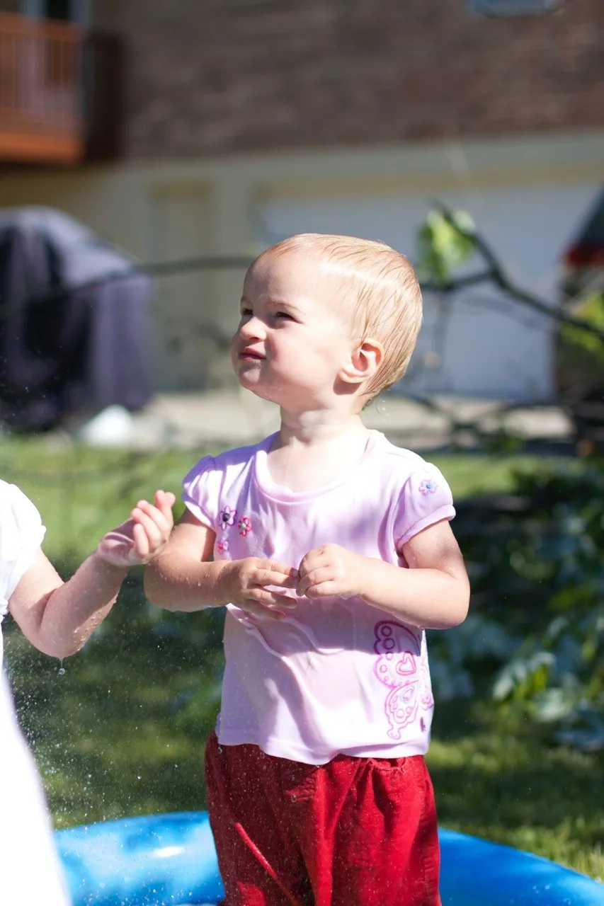 The girls, especially Gwen, had so much fun playing in the hose today. Gwen loved being sprayed in the face – just like her big sister at this age. I think we might have at least two future swimmers amongst us!