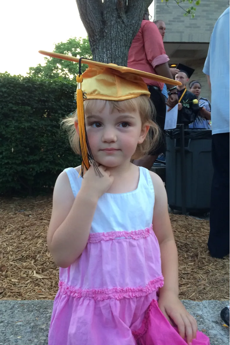 Abby at Clara’s high school graduation today & Clara at my UC master’s school graduation in 2002.