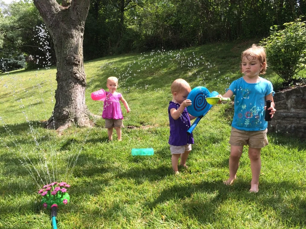 Sprinkler fun – our now daily summer pastime.