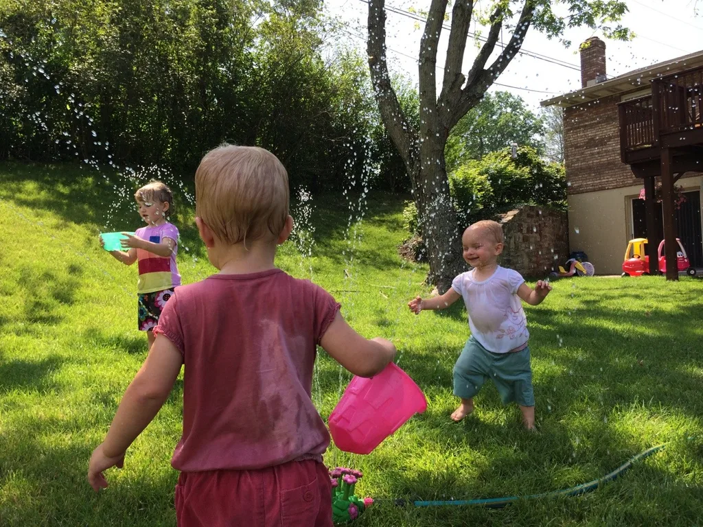 Sprinkler fun – our now daily summer pastime.