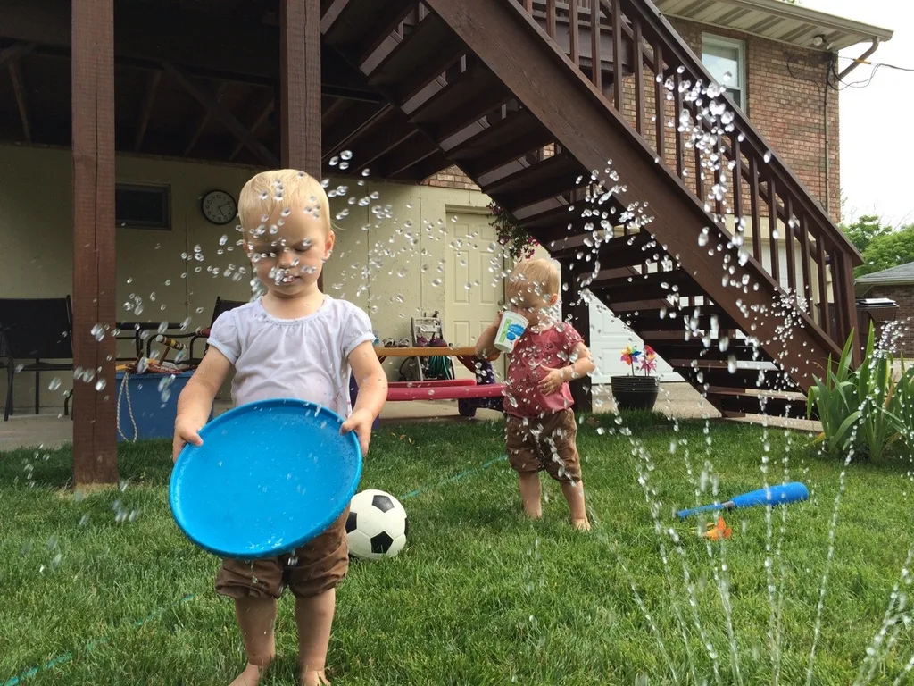 Sprinkler fun – our now daily summer pastime.
