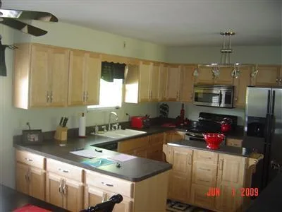 Here are the photos from the listing for our house when we bought it in 2010. I certainly don’t miss the dark colors and the famous “banana boat” fan. It’s amazing to look back and think about all the changes we made since then. Some highlights:

*   painted every room
*   replaced all the carpet
*   replaced every light fixture and outlet
*   replaced every door knob and hinge
*   added window trim in the bedrooms and kitchen
*   updated the deck

We came a long way!