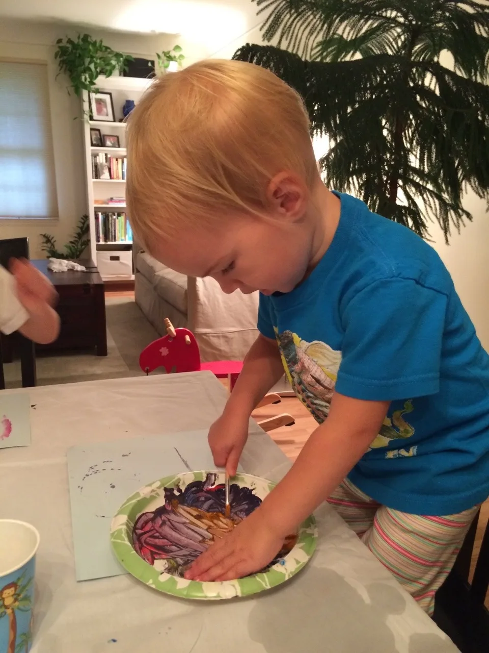 Three girls, three painting personalities… I brought out two pieces of paper for each girl. Josie was so busy mixing paint colors on her plate that she barely used one sheet. Gwen used one sheet too, but only because she was focused and determined to perfect her masterpiece. Abby, on the other hand, happily snatched up the spare paper. She needed to paint pictures for everyone!

Thirty plus minutes of painting was pretty good for little ones. If it had kept them occupied longer, I would have given them all the paper they wanted! 😉