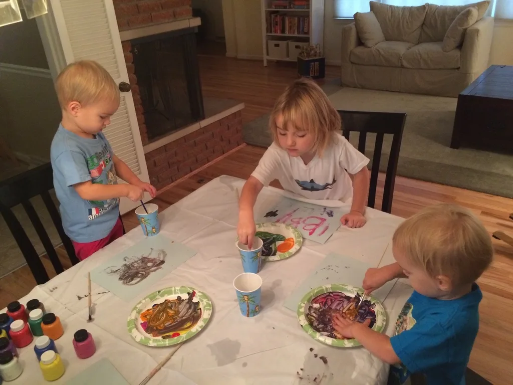 Three girls, three painting personalities… I brought out two pieces of paper for each girl. Josie was so busy mixing paint colors on her plate that she barely used one sheet. Gwen used one sheet too, but only because she was focused and determined to perfect her masterpiece. Abby, on the other hand, happily snatched up the spare paper. She needed to paint pictures for everyone!

Thirty plus minutes of painting was pretty good for little ones. If it had kept them occupied longer, I would have given them all the paper they wanted! 😉