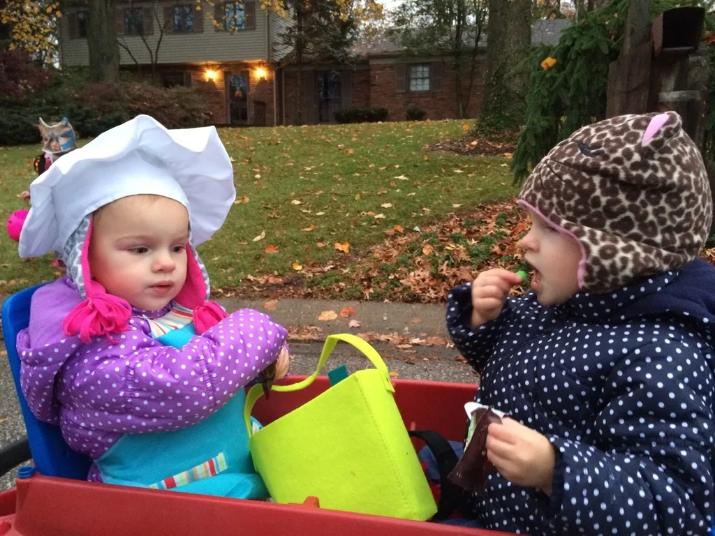 Trick-or-treating in our new neighborhood was awesome! There were tons of kids, lots of folks were outside passing out treats while enjoying a fire, and the fire department even brought a truck (with flashing lights) to pass out full-sized candy bars! The girls had a really good time. Gwen and Josie were too tuckered out after awhile, but they greatly enjoyed eating their goodies while we chased Abby around with their wagon.