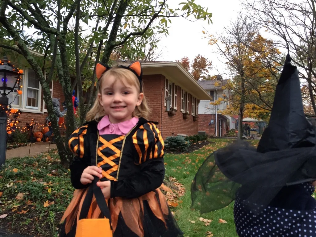 Trick-or-treating in our new neighborhood was awesome! There were tons of kids, lots of folks were outside passing out treats while enjoying a fire, and the fire department even brought a truck (with flashing lights) to pass out full-sized candy bars! The girls had a really good time. Gwen and Josie were too tuckered out after awhile, but they greatly enjoyed eating their goodies while we chased Abby around with their wagon.