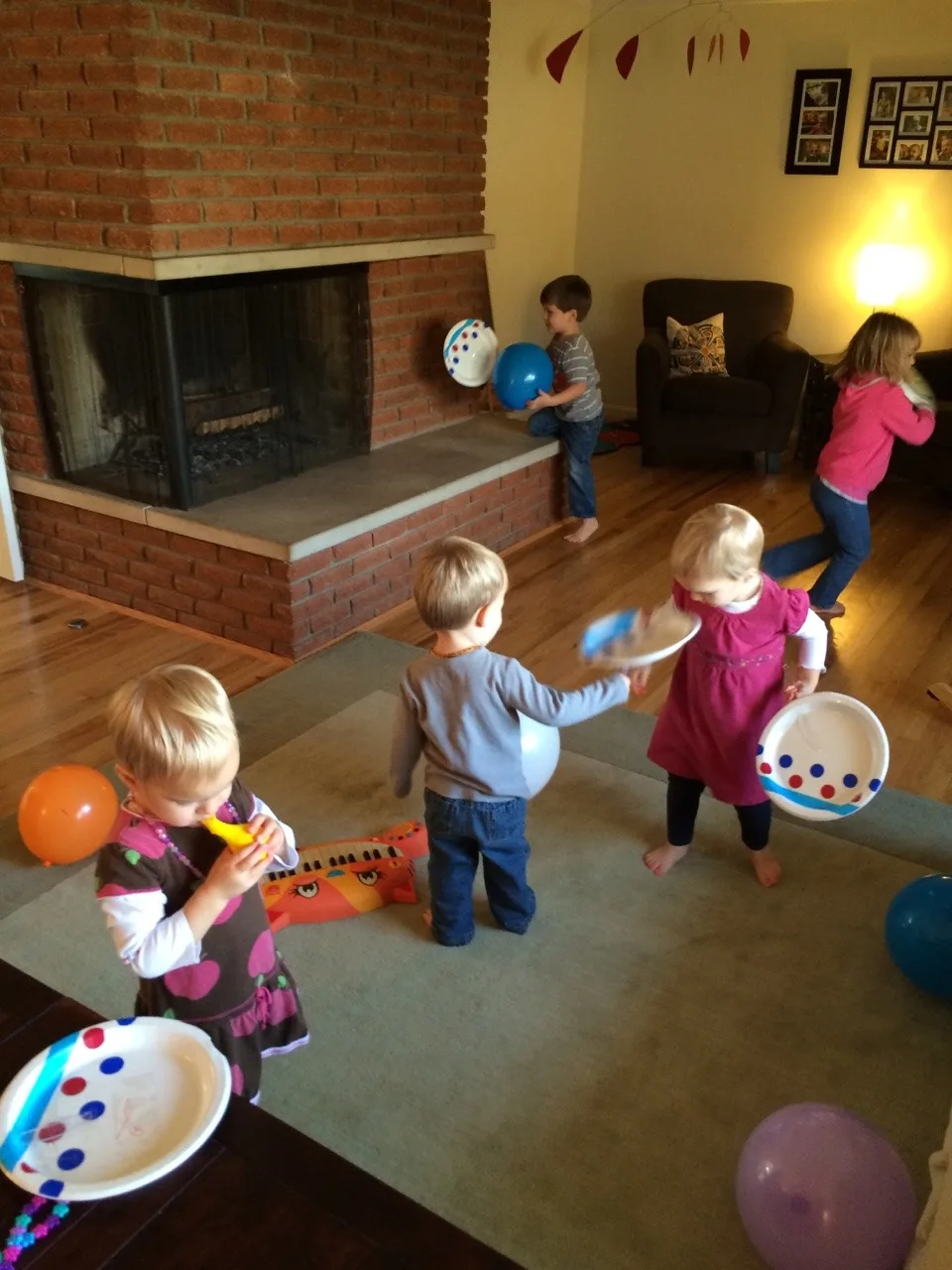 How does one entertain five little kids? By letting them design and then play with homemade “tennis rackets” and “balls.”