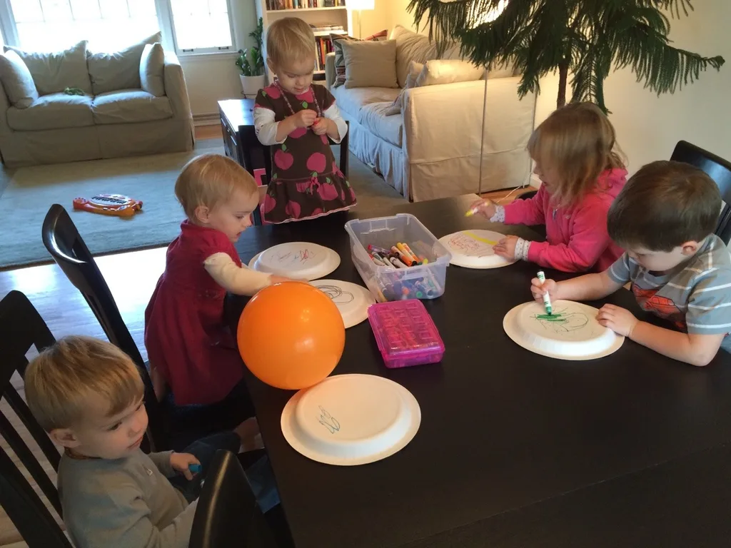 How does one entertain five little kids? By letting them design and then play with homemade “tennis rackets” and “balls.”