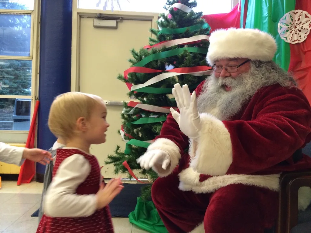 We all had a good time this morning at the Moeller Rugby Breakfast with Santa. Craft time with “Tickle Monster” Joey was especially popular. It took nearly two hours, but the girls eventually warmed up to the idea of visiting with Santa. Abby said she was going to test him to see if he was the real Santa by asking him if he had reindeer. He passed!