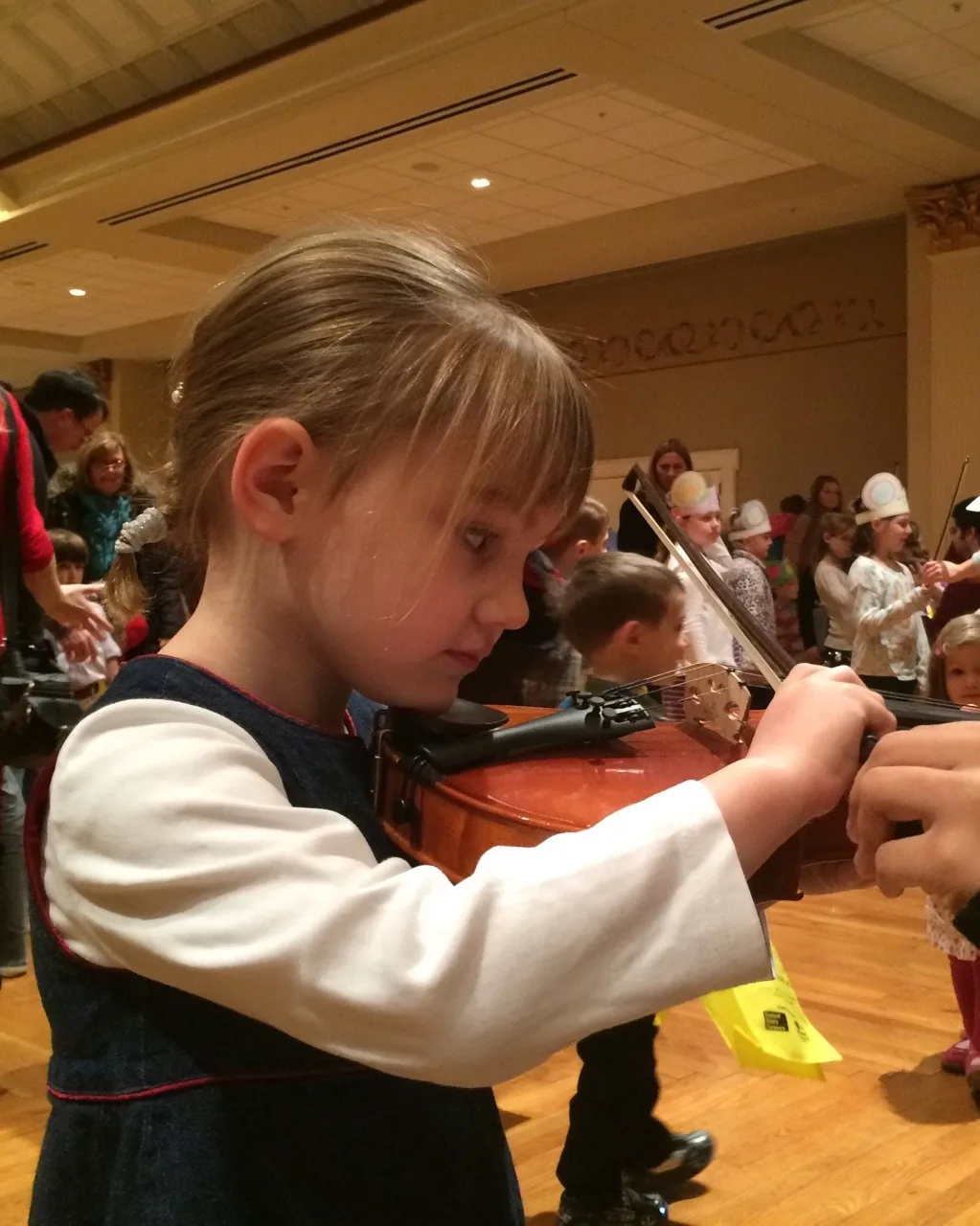 Experimenting with the violin before the Lollipops concert at Music Hall this morning.