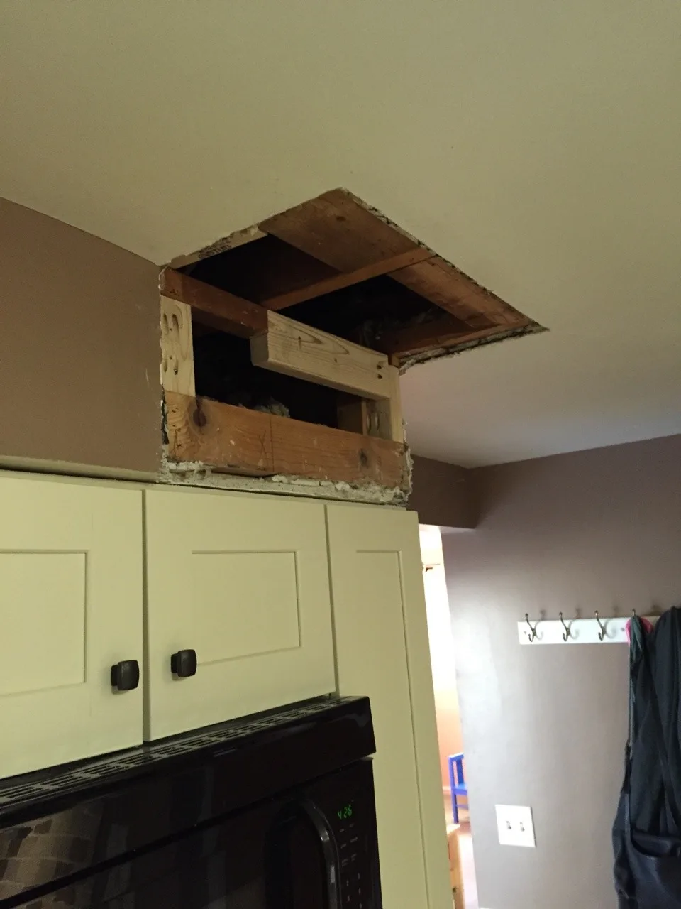 The inexplicable (vestigial?) soffit is gone! Next up is repainting the kitchen.