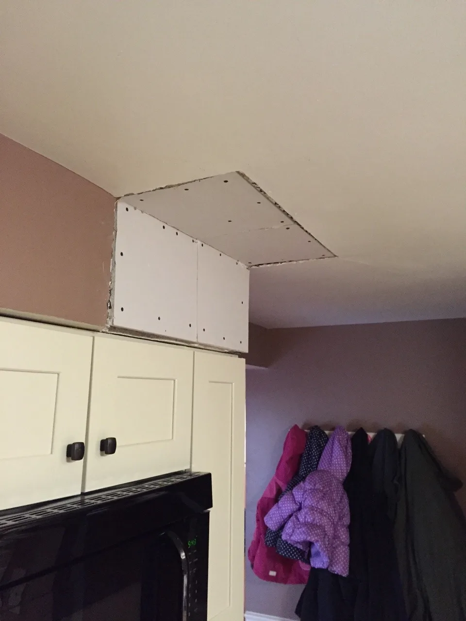 The inexplicable (vestigial?) soffit is gone! Next up is repainting the kitchen.