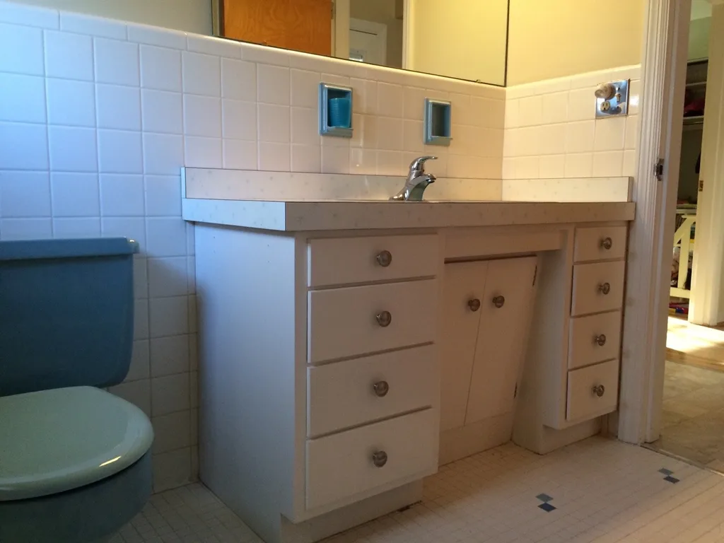 Since we didn’t want to expose our sick kids to paint fumes this weekend, we decided to tackle another project. The bathroom seems so much bigger and nicer now!