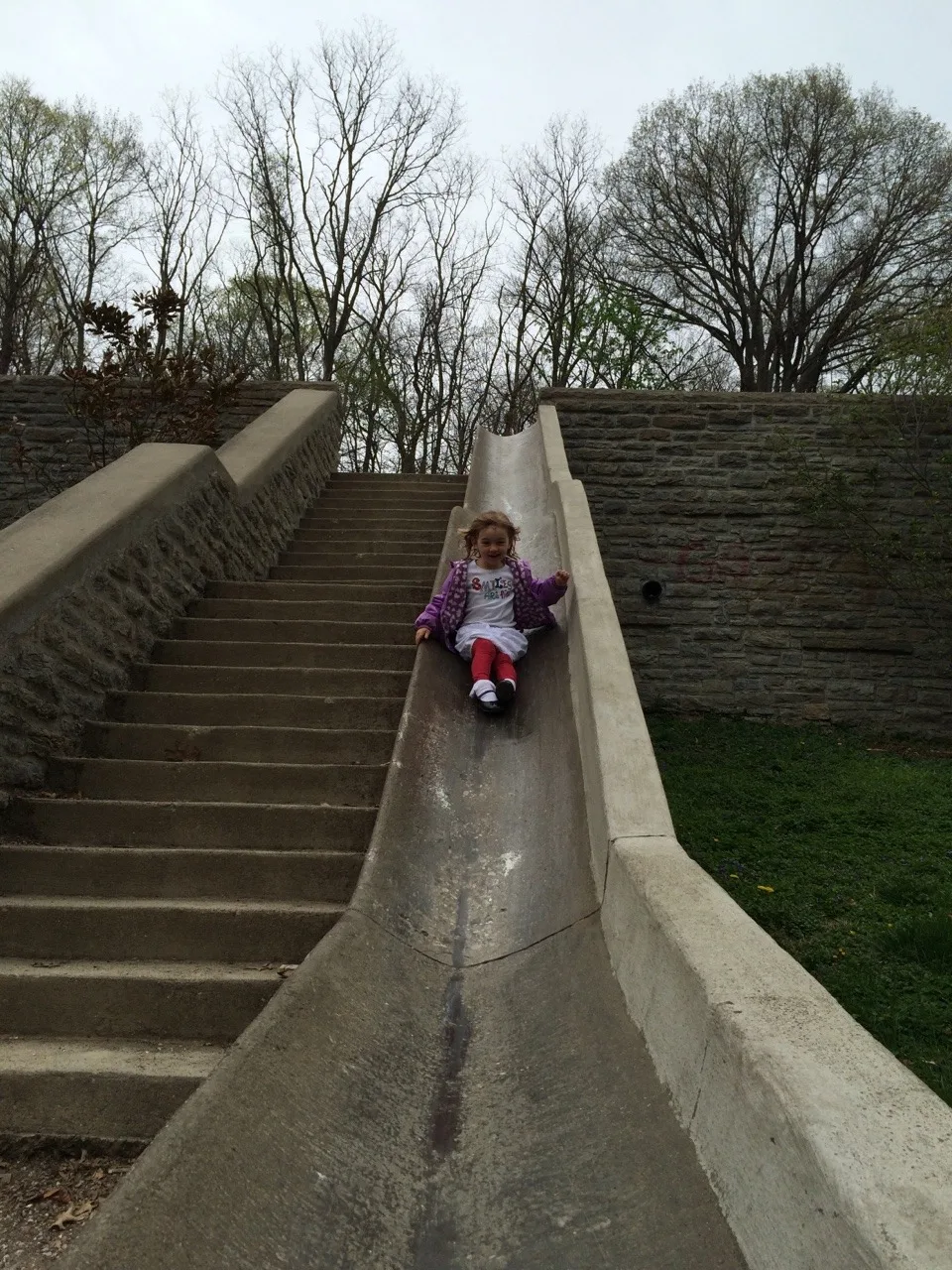Mark this off the childhood must do list: riding the slide at Burnet Woods. Abby loved it!