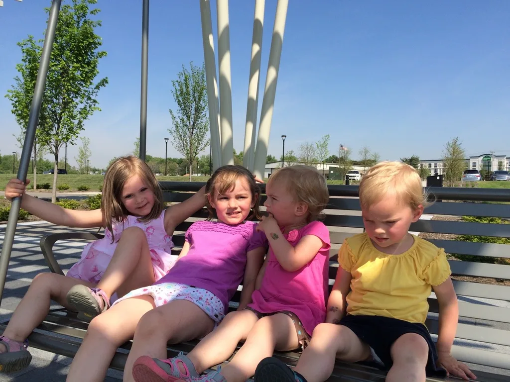 It felt like summer today! We got all hot and sweaty with a Madeira Moms playgroup at the new Blue Ash Summit Park. The girls enjoying playing on the awesome (albeit sun-drenched) play structure, swinging on the over-sized porch swings, and doing “tricks” on the great lawn. They capped off the fun by cooling off in their backyard pool. I hope they take great naps because all that sun and excitement sure wore me out!