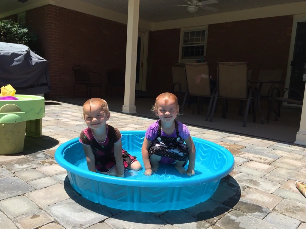 Two silly girls, who really like to dunk their faces, cooling off after our twin playgroup today.