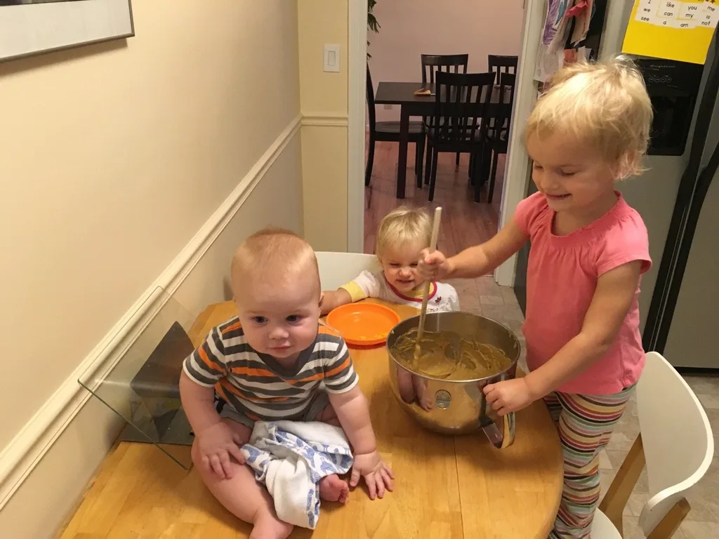 Fun activities for a rainy morning: playing dress-up, reading the dictionary, reviewing recipes, helping to make pumpkin bread, and coloring.