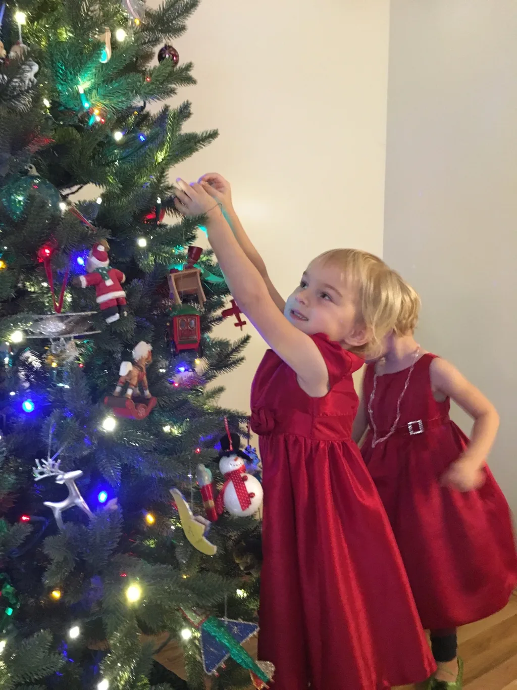 We happily spent Black Friday morning at home, dressed in our Christmas finery, decorating the tree.