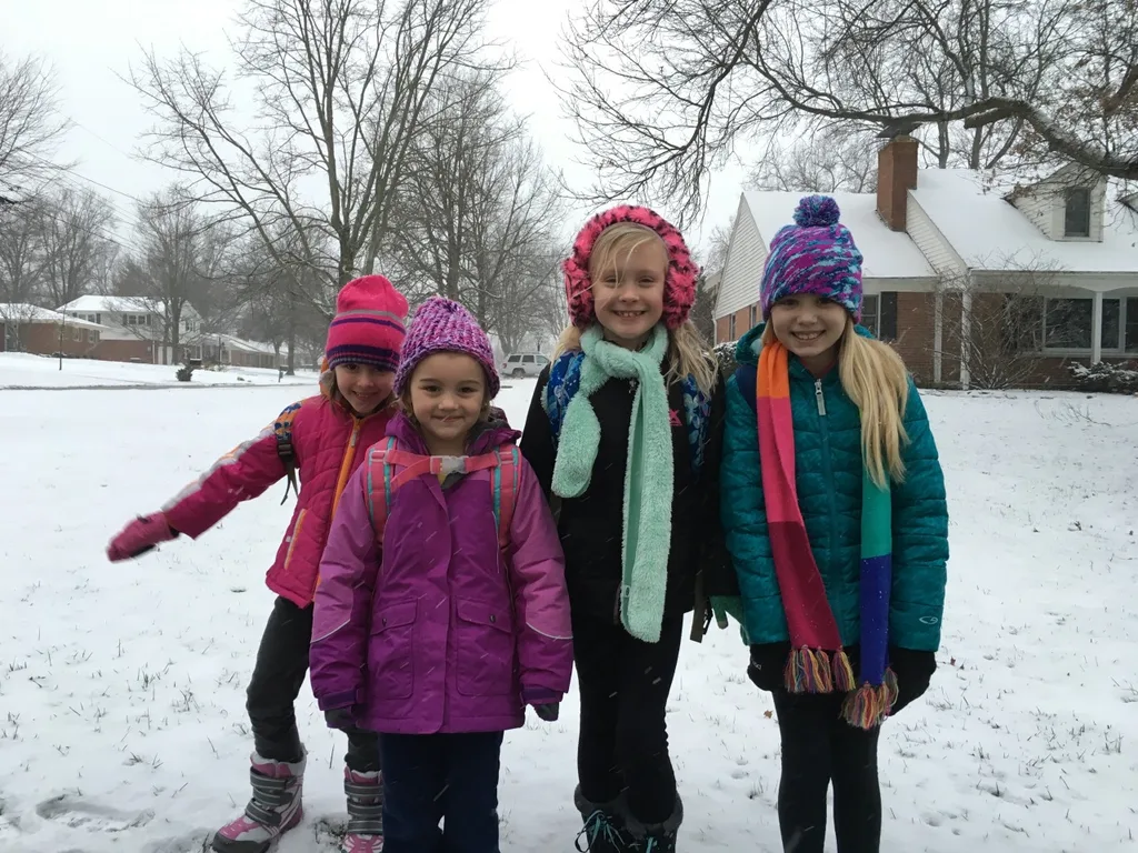 They may have preferred a day off school, but a snowy morning at the bus stop is fun too.