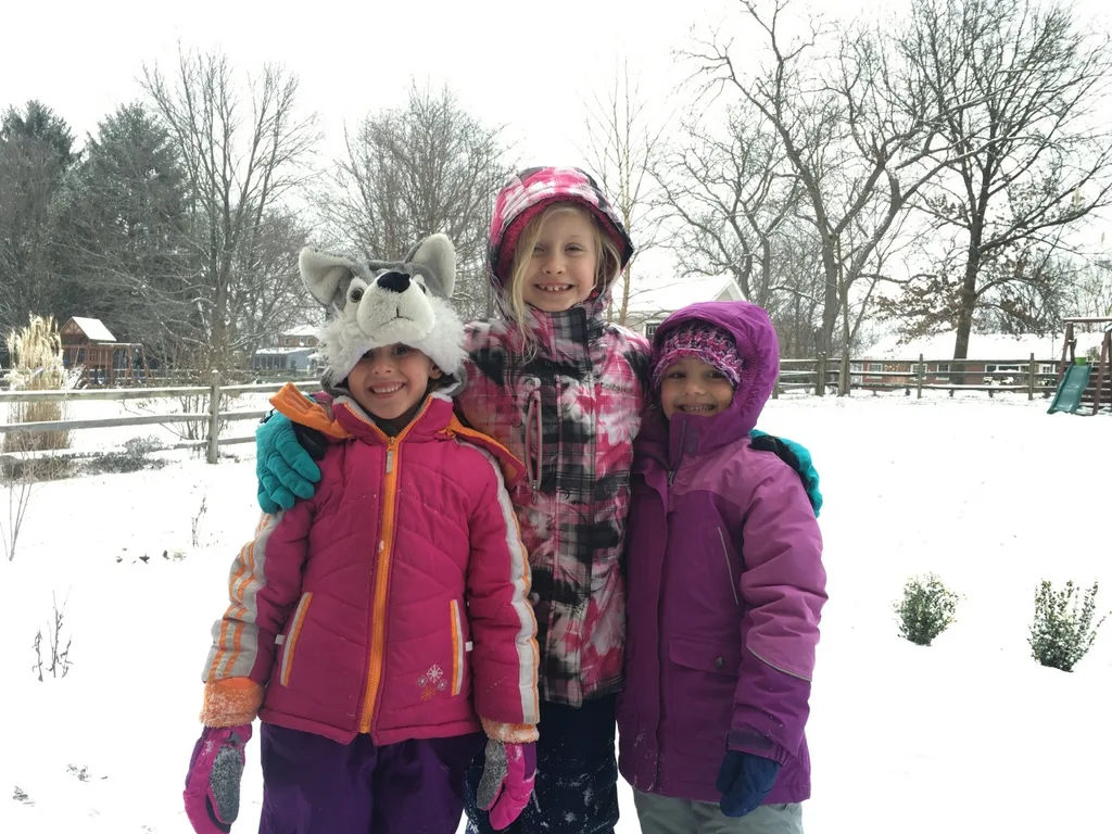 Her first snow day! Abby had a good time frolicking with friends instead of going to school today. (And I enjoyed capturing this photo of Nora in her silly hat!)