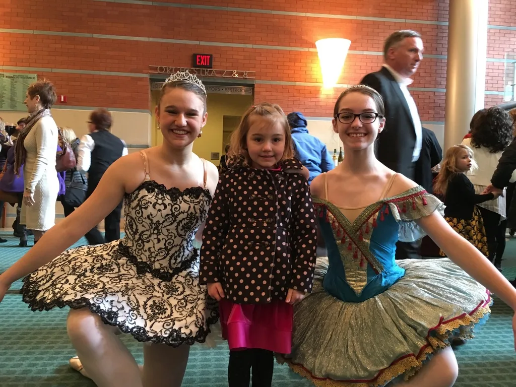 Our brave girl suddenly grew timid while posing with two ballerinas at the Ballet’s production of Cinderella today.