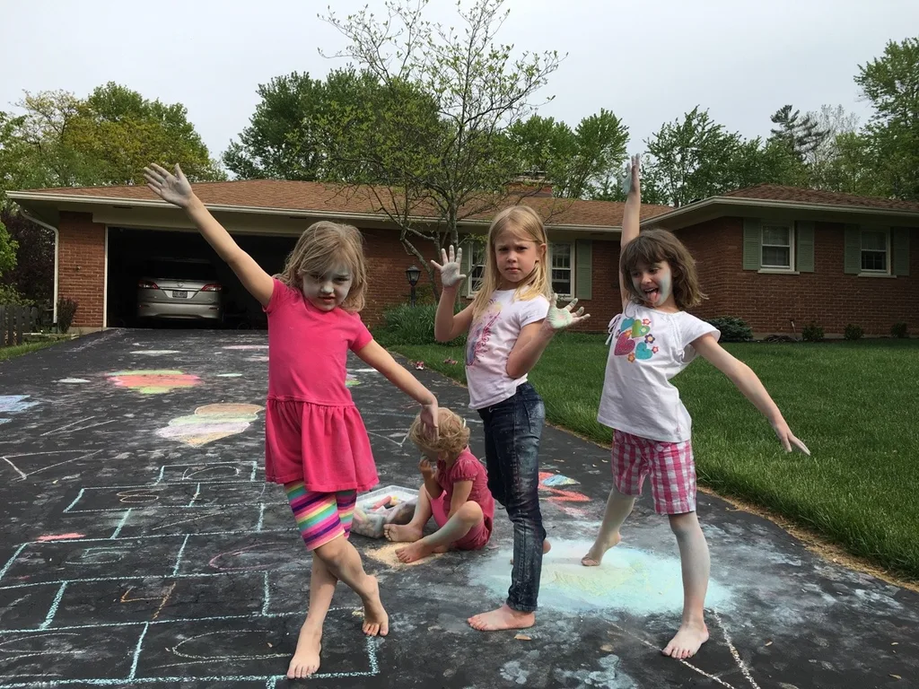 They used some of the new chalk for drawing on the driveway.