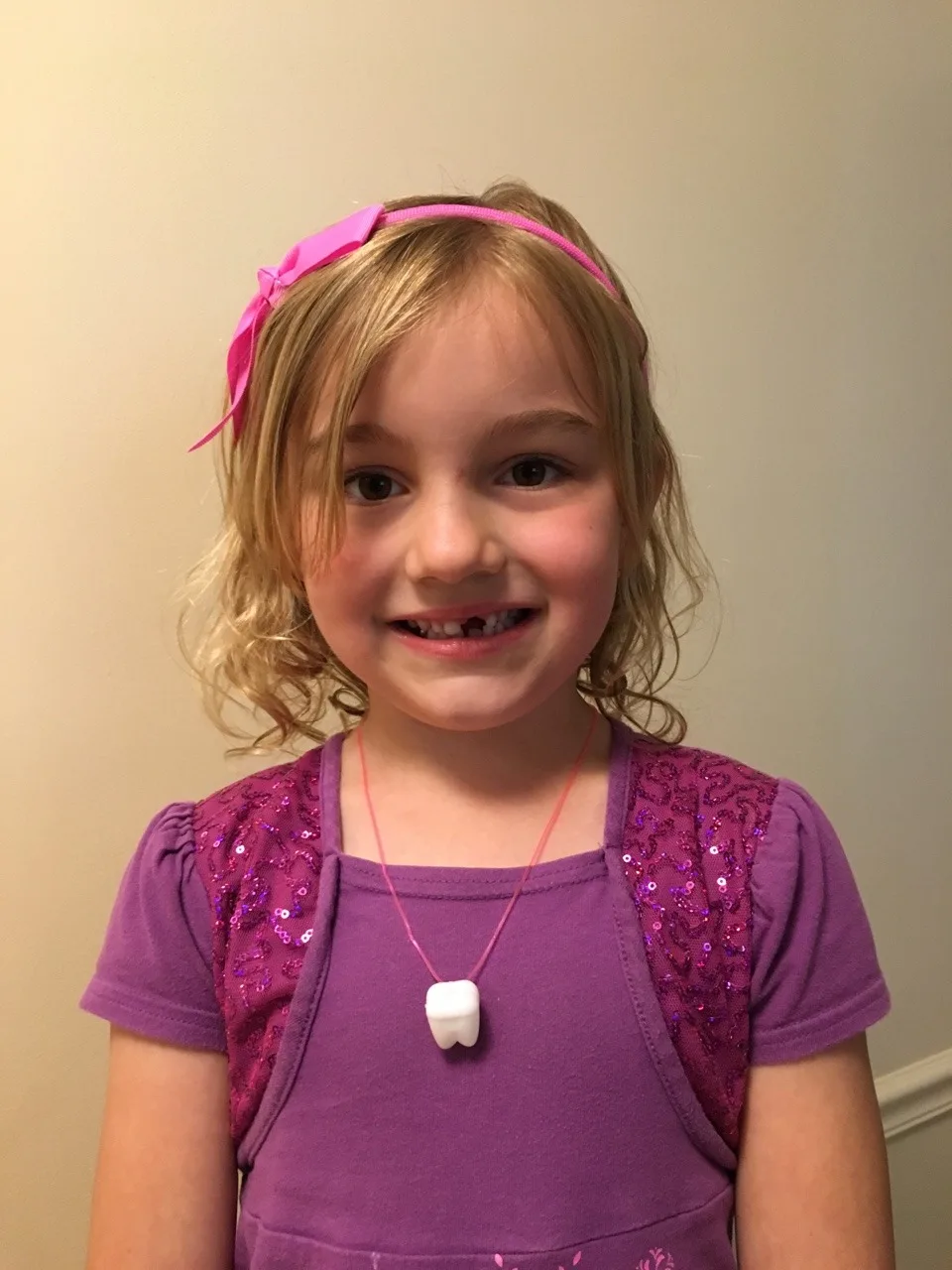This silly girl took Nora’s advice and “punched out” her loose tooth on the morning school bus.