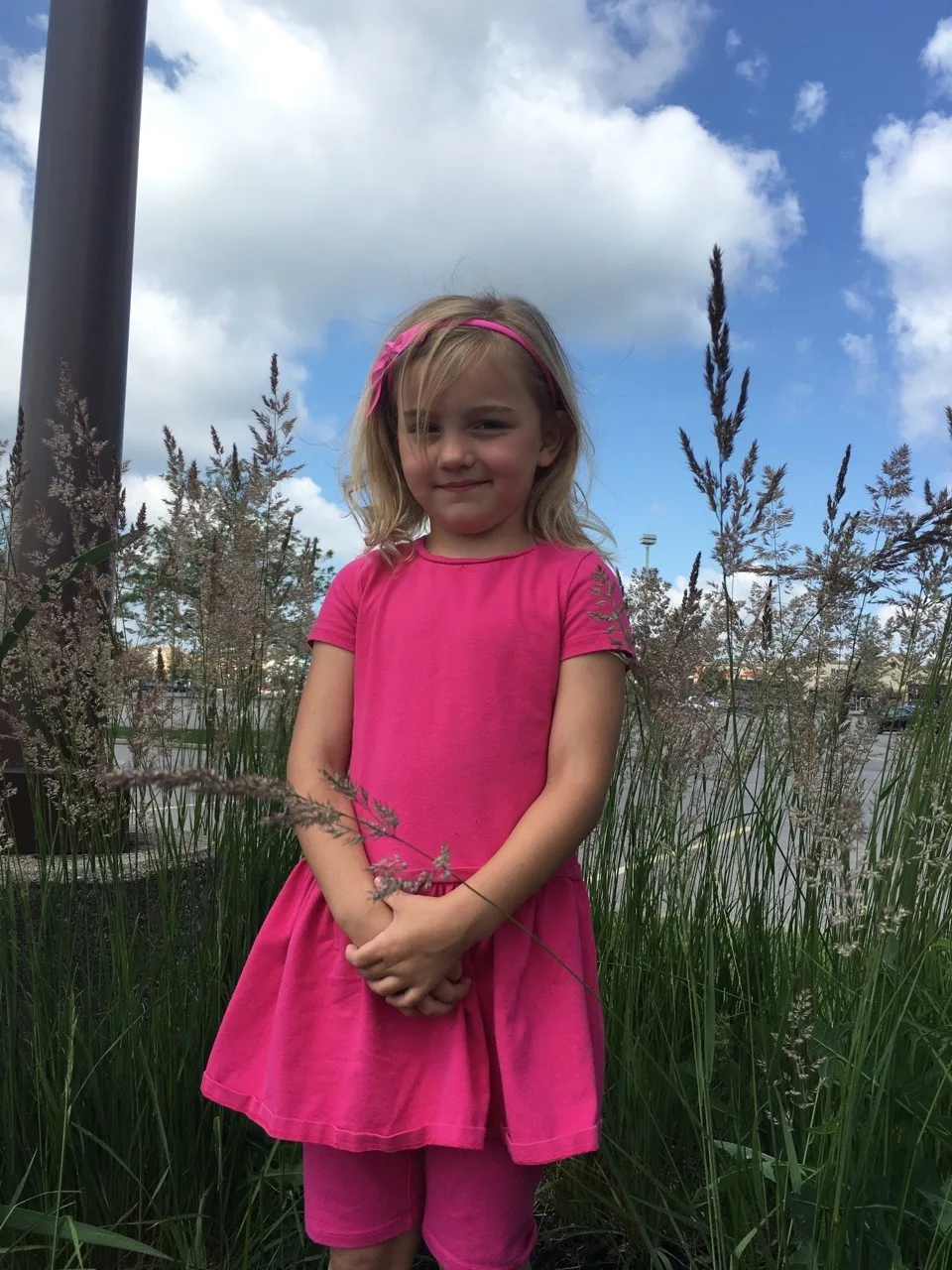 These silly girls wanted their pictures taken in the tall grass near Costco! I guess they can appreciate something pretty in nature wherever they find it.