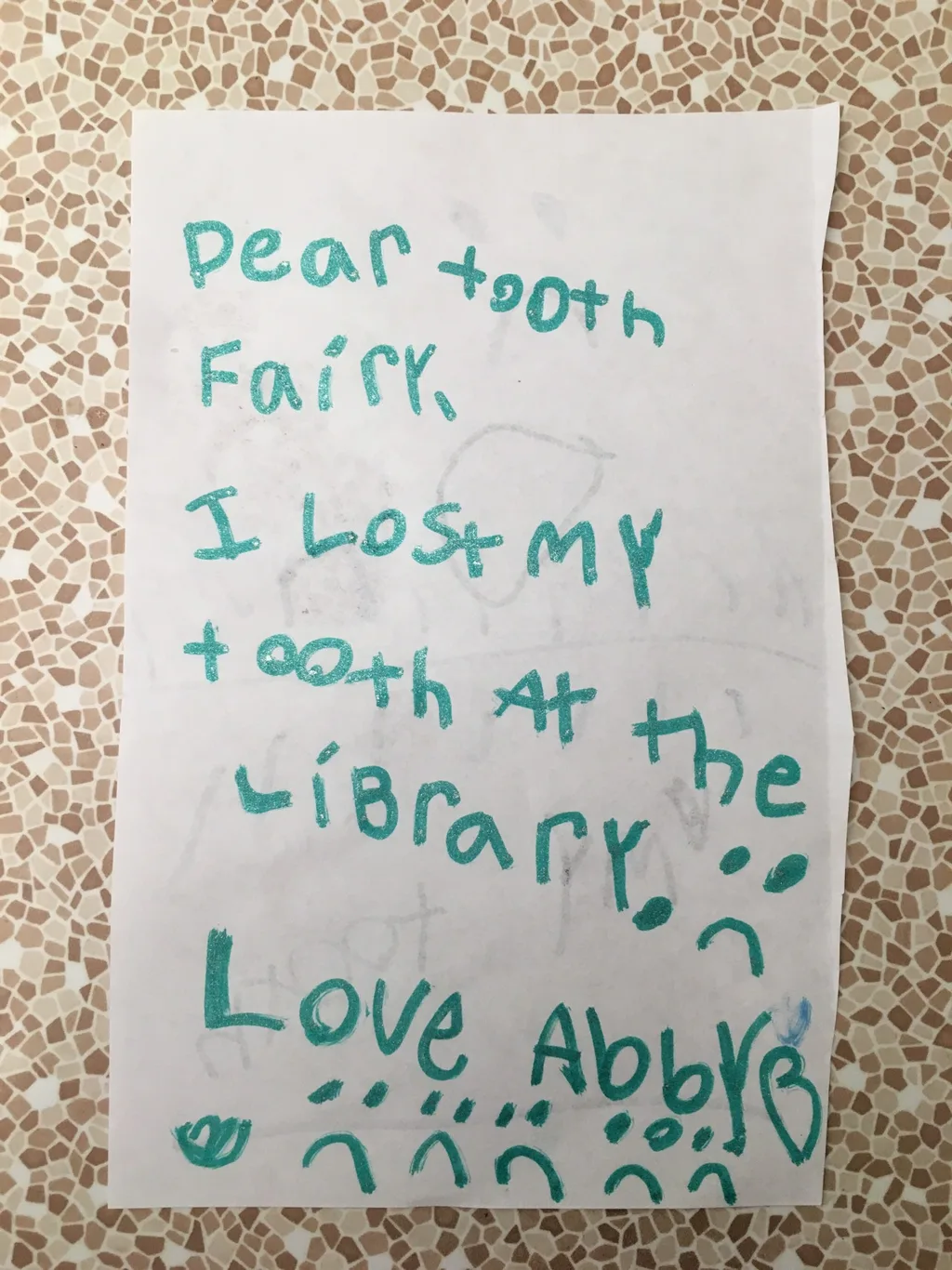 Abby lost another front tooth today! Nora again told her to “punch it out!” Her other audience members agreed, but this one took some twisting and turning. She was bloody and thrilled when it finally popped out. And, then she misplaced it at the library! Luckily, the tooth fairy accepts letters and chocolate coins.