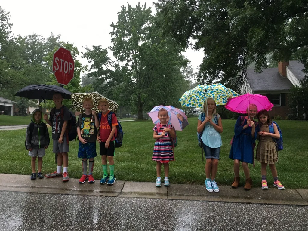 First day of first grade! Even the pouring rain couldn’t put a damper on the excitement at the bus stop this morning.