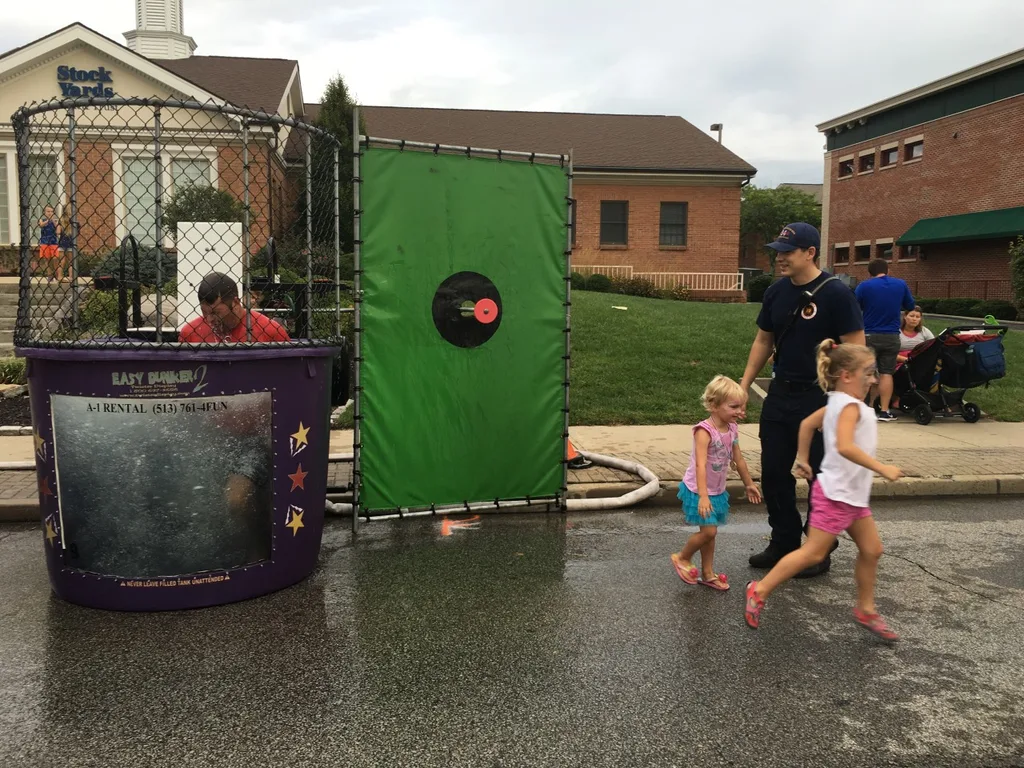 These girls finally got to dunk a firefighter at the Madeira Street Dance! Perhaps their throwing wasn’t quite powerful enough, but their hands sure could push in that target!