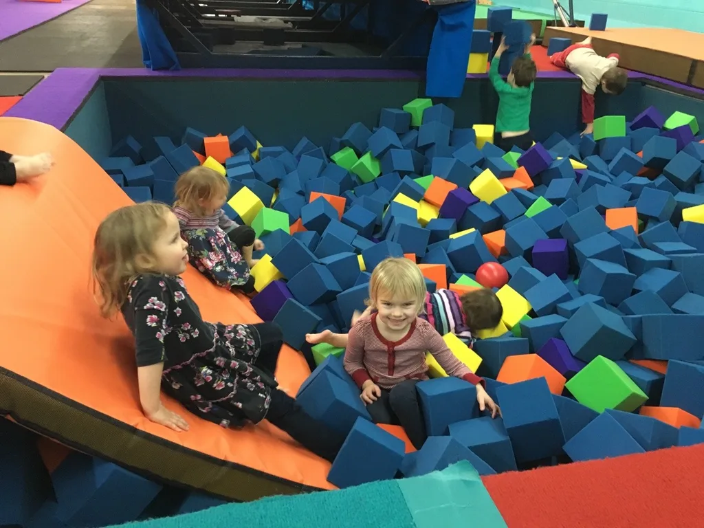 The girls love that our preschool playgroup keeps meeting at Gym Skills.
