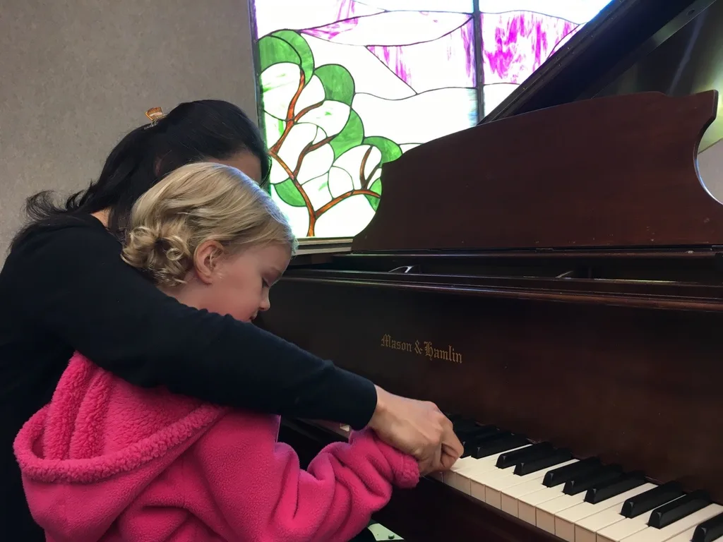 Gwen sat on my lap, but Josie boldly participated in the Peanut Butter and Jam concert today.