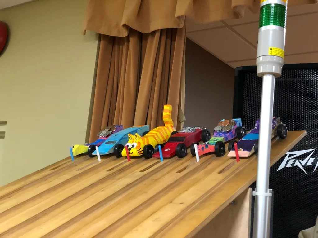 What a fun Girl Scout day - Pinewood Derby and Cosmic Bowling!